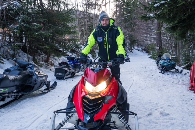 Adventure group in snowy mountain valley